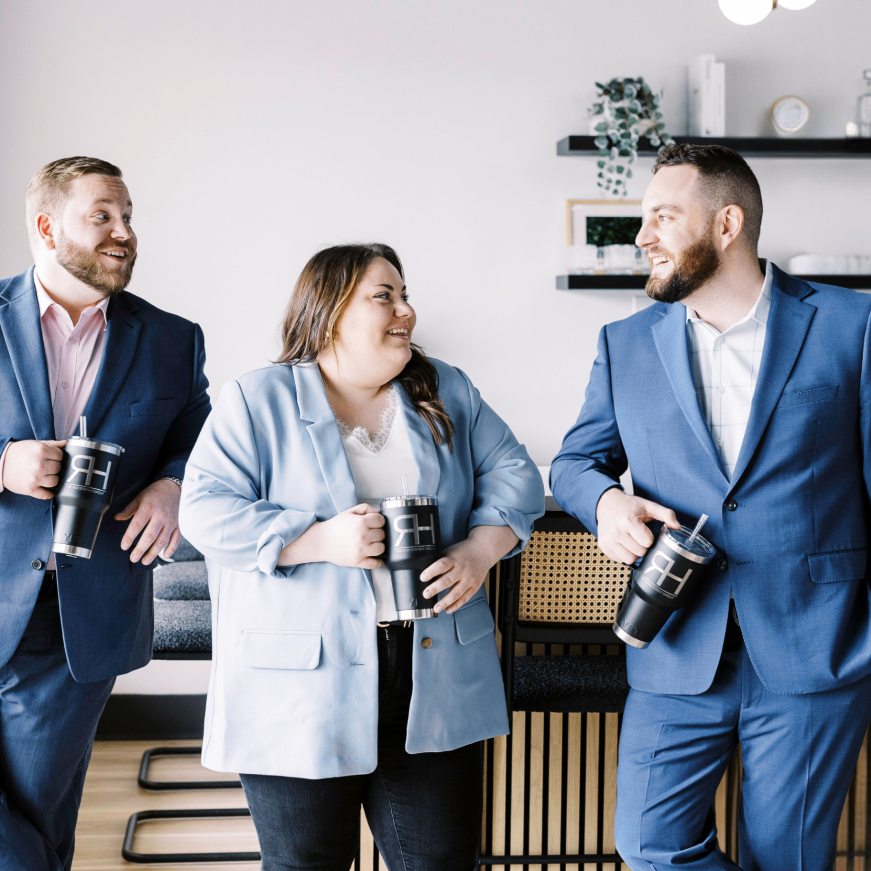 The Hoesterey Group team laughing together in the office